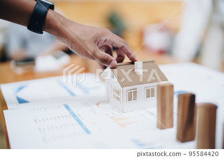 Model house and wooden stick, insurance concept. 95584420