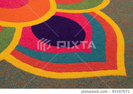 Close-up view of the beautiful colorful Indian traditional rangoli decoration for Diwali or Deepavali celebration Close-up view of the beautiful colorful Indian traditional rangoli decoration for Diwali or Deepavali celebration 95587072