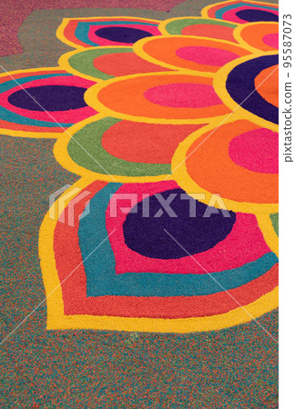 Close-up view of the beautiful colorful Indian traditional rangoli decoration for Diwali or Deepavali celebration Close-up view of the beautiful colorful Indian traditional rangoli decoration for Diwali or Deepavali celebration 95587073