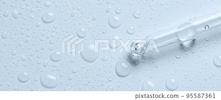 Micellar water drops and pipette. Cosmetic product for moisturizing the skin or removing makeup. Close-up, macro photography Micellar water drops and pipette. Cosmetic product for moisturizing the skin or removing makeup. Close-up, macro photography 95587361