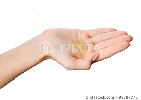 Moisturizing gel on the palm of female hand 95587773