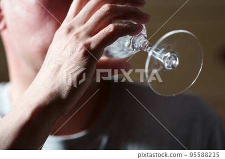 man drinking wine from wine glass man drinking wine from wine glass 95588215