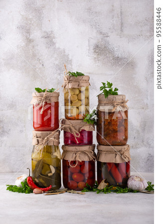 Pickled vegetables in glass jars. Pickled vegetables in glass jars. 95588446