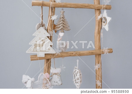 Decorative wooden staircase, decorated with children's toys for Christmas 95588930