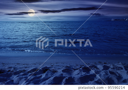minimalistic seascape in summer at night. beach sea and horizon in full moon light. purity in nature 95590214