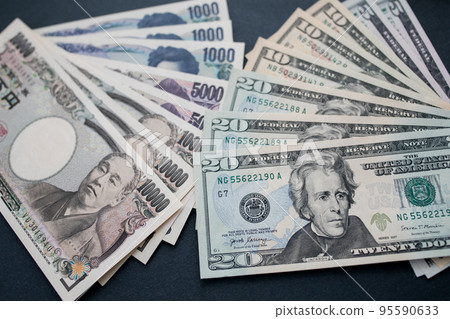 Japanese yen and US dollar banknotes Japanese yen and US dollar banknotes 95590633