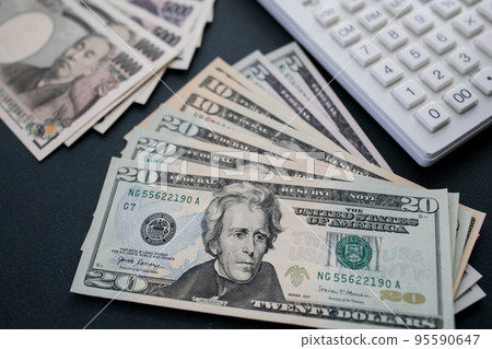 Japanese yen and US dollar banknotes Japanese yen and US dollar banknotes 95590647