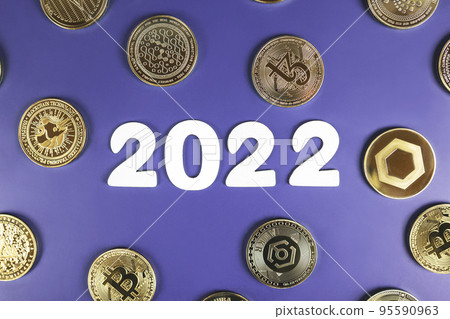 Cryptocurrency in 2022 price prediction, value forecast concept. Golden crypto coins Bitcoin, Uniswap, Nano, Tezos, Ankr, Chainlink next to the white year numbers on purple background. Cryptocurrency in 2022 price prediction, value forecast concept. Golden crypto coins Bitcoin, Uniswap, Nano, Tezos, Ankr, Chainlink next to the white year numbers on purple background. 95590963