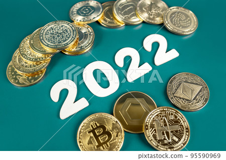 Cryptocurrency in 2022 price value prediction, forecast concept. Golden crypto coins Bitcoin, Ethereum, Tether, Nano, Chainlink and other next to the year numbers on green background. Cryptocurrency in 2022 price value prediction, forecast concept. Golden crypto coins Bitcoin, Ethereum, Tether, Nano, Chainlink and other next to the year numbers on green background. 95590969