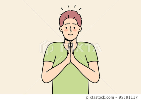 Young man with hands in prayer  95591117