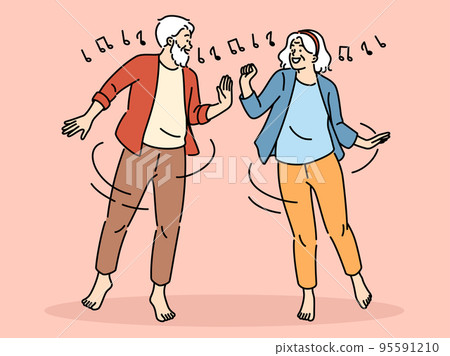 Smiling mature couple dancing Smiling mature couple dancing 95591210