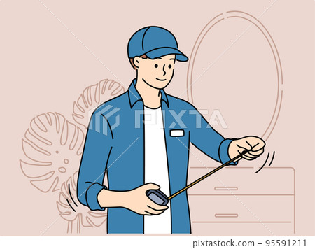 Male mechanic with tape measure work in room Male mechanic with tape measure work in room 95591211