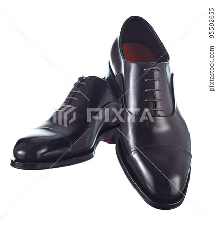 Beautiful pair of classic men's shoes made of glossy plum-colored leather, lace-up, with leather soles, isolated on a white background. Vertical image. 95592655