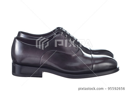 Beautiful pair of classic men's shoes made of glossy plum-colored leather, lace-up, with leather soles, isolated on a white background. Side view. 95592656
