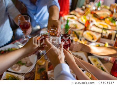 Clinking glasses with alcohol and toasting, party. Clinking glasses with alcohol and toasting, party. 95593537