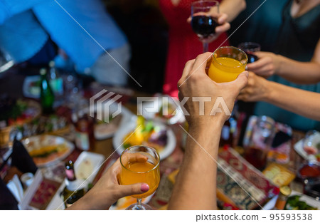 Clinking glasses with alcohol and toasting, party. Clinking glasses with alcohol and toasting, party. 95593538