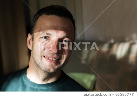Close up face portrait of smiling young adult man Close up face portrait of smiling young adult man 95593777