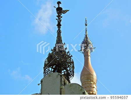 Myanmar style temple pagoda spire crown blue sky back Myanmar style temple pagoda spire crown blue sky back 95594037