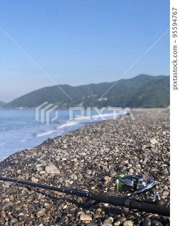 enjoy fishing from the shore 95594767