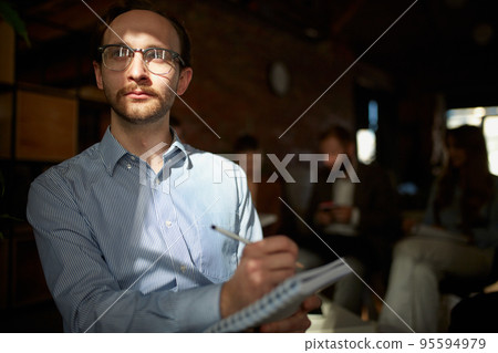 Young man in bussiness style clothes thinking, dreaming at working day in office room. Business, finance, professional occupation, ideas, plans Young man in bussiness style clothes thinking, dreaming at working day in office room. Business, finance, professional occupation, ideas, plans 95594979