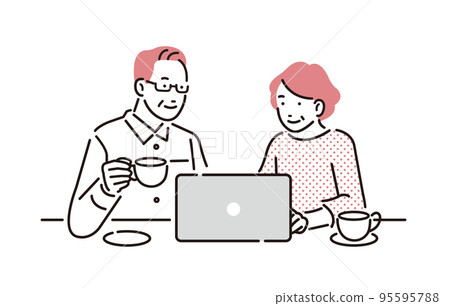 Senior couple looking at personal computer 95595788