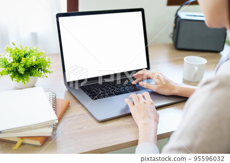 woman working on a white screen computer. woman working on a white screen computer. 95596032