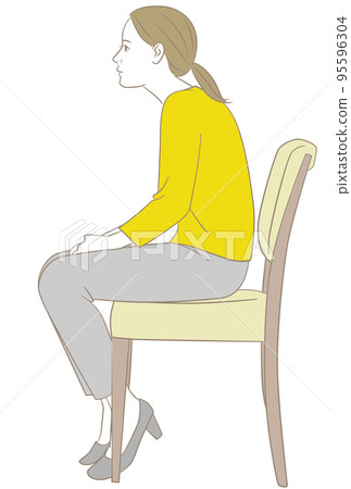 一個女人坐在椅子上,彎著腰 一個女人坐在椅子上,彎著腰 95596304
