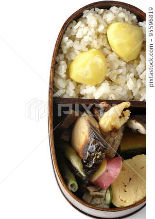 A bento box filled with autumn flavors such as chestnut rice and sweet potatoes in magewappa 95596819
