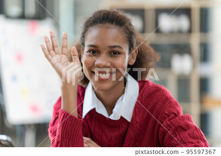 Portrait of beautiful young black woman using digital tablet. Portrait of beautiful young black woman using digital tablet. 95597367