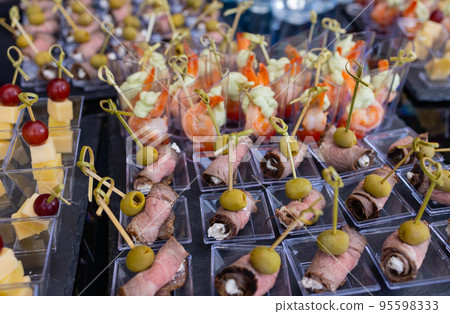 buffet table - a lot of canapes and sandwiches, shallow DOF. 95598333