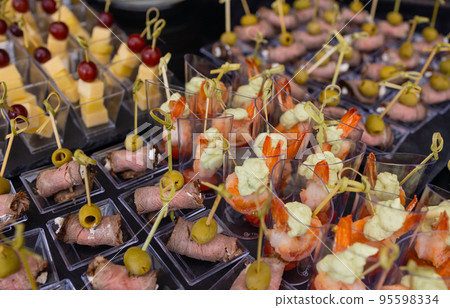 buffet table - a lot of canapes and sandwiches, shallow DOF. buffet table - a lot of canapes and sandwiches, shallow DOF. 95598334