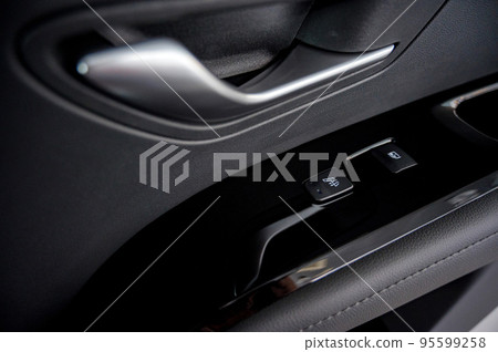 Business car window control buttons. Interior details. 95599258
