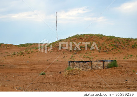 Red Clay field, with communication tower and brick tank. 95599259