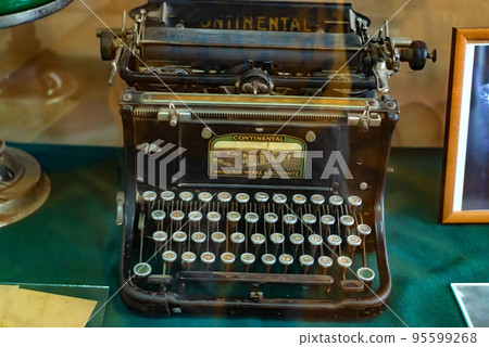 Exhibition of an old black typewriter, close-up photo. 95599268