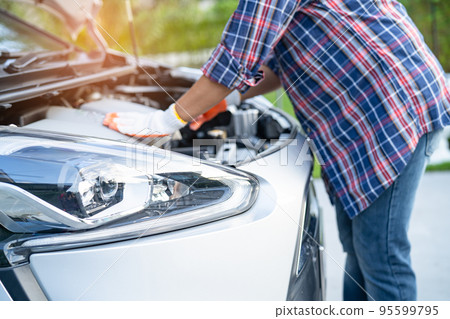Open hood mechanic engine system to check and repair damage car crash. Open hood mechanic engine system to check and repair damage car crash. 95599795