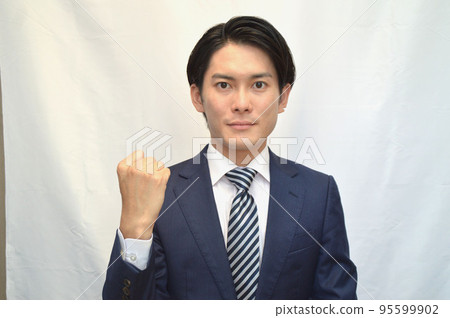 Businessman guts pose smile 95599902