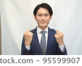 Businessman guts pose smile 95599907