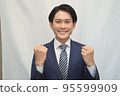 Businessman guts pose smile 95599909