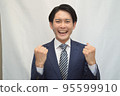 Businessman guts pose smile 95599910