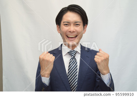 Businessman guts pose smile 95599910