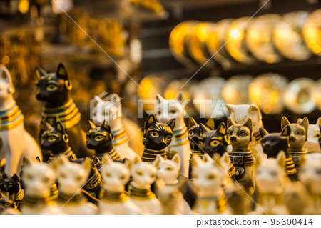 Souvenir in the form of a cat in the old bazaar of Egypt close-up. 95600414