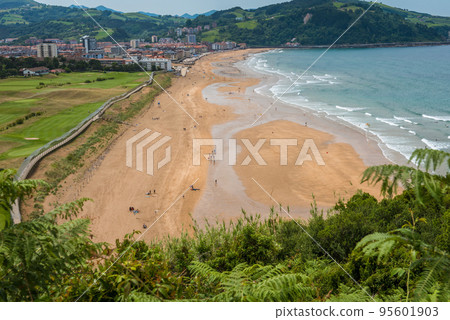 Aerial view to the Zarautz Beach and golf field in Basque Country, Spain on a beautiful summer day Aerial view to the Zarautz Beach and golf field in Basque Country, Spain on a beautiful summer day 95601903