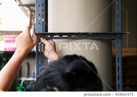 do it yourself concept, Craftsmen to assemble old iron parts. Make a shelf on your free weekend. do it yourself concept, Craftsmen to assemble old iron parts. Make a shelf on your free weekend. 95602471
