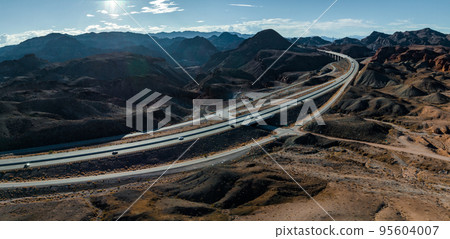 Aerial view of highway in California, United States. Scenic landscape, road, desert. Driving truck, car. Traveling. View from above, drone shot. 95604007