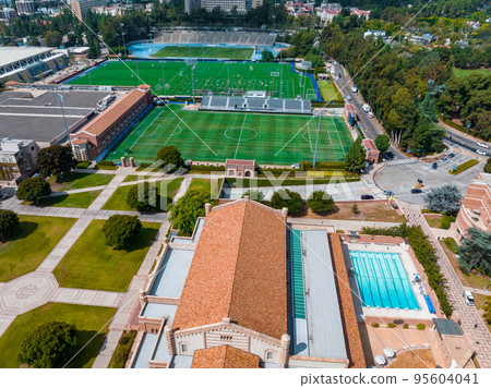 Aerial view of the Football stadium at the University of California, Los Angeles, UCLA. Royce Hall is one of four original buildings of the UCLA campus. 95604041