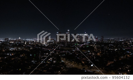 View of Downtown Los Angeles from the Hollywood Hills. Interstate 101 is shown in the foreground. 95604132
