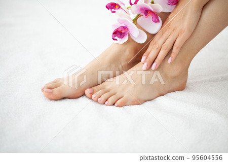 Female legs and hands after pedicure and manicure. 95604556