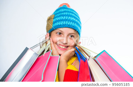 Shopping on black friday. Girl amazed face knitted hat hold shopping bags white background. Amazing shopping concept. Buy clothes amazing discount. Get promo code. Amazing sale and discount 95605185