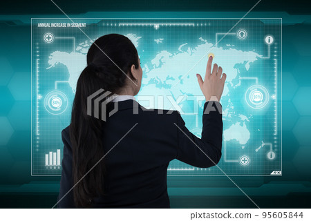 Young business lady works with virtual graphic interface in futuristic office 95605844