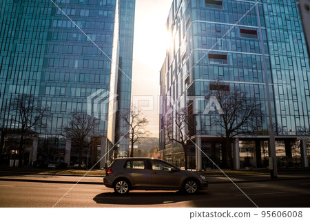 Sun goes through city skyscraper public transport scene in Gdansk. Oliva business district Transport city traffic. Trams buses cars City Traffic Jam Sun goes through city skyscraper public transport scene in Gdansk. Oliva business district Transport city traffic. Trams buses cars City Traffic Jam 95606008